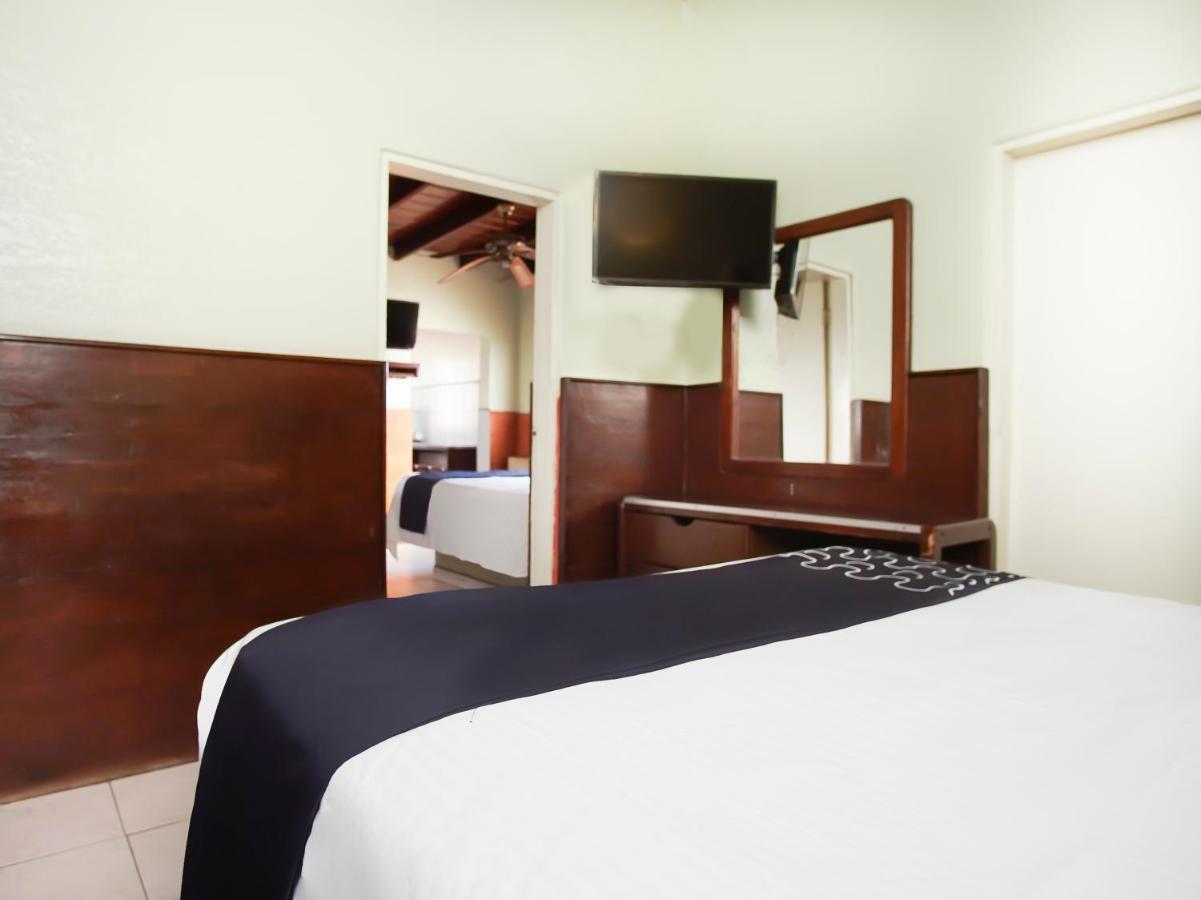 Capital O Hotel America 恩塞纳达港 外观 照片